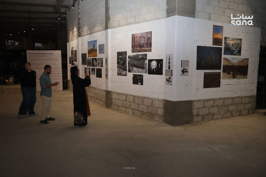 Visitors exploring the photography exhibition at Art Week Syria